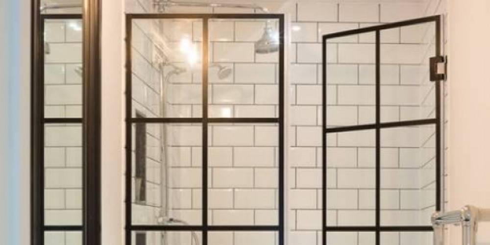 Top Shelf specializes in custom frameless shower doors.